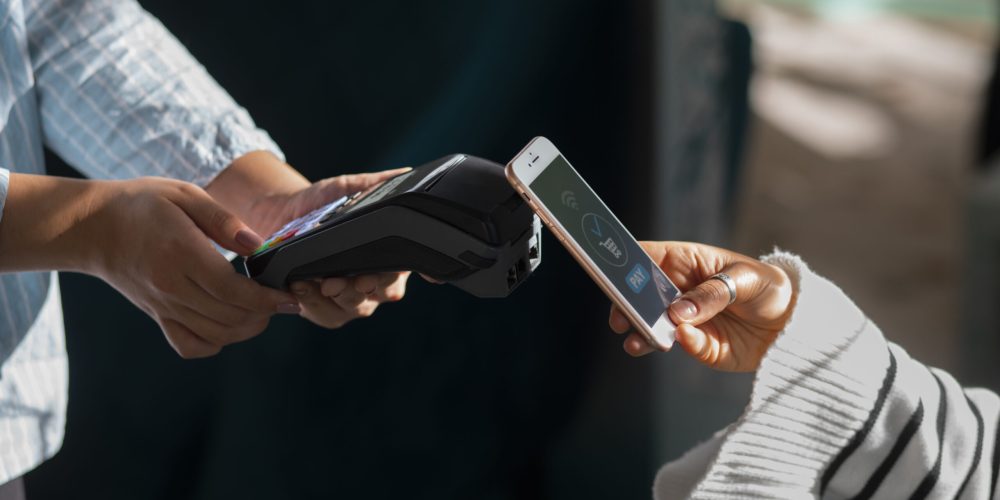 person-paying-with-nfc-technology-restaurant